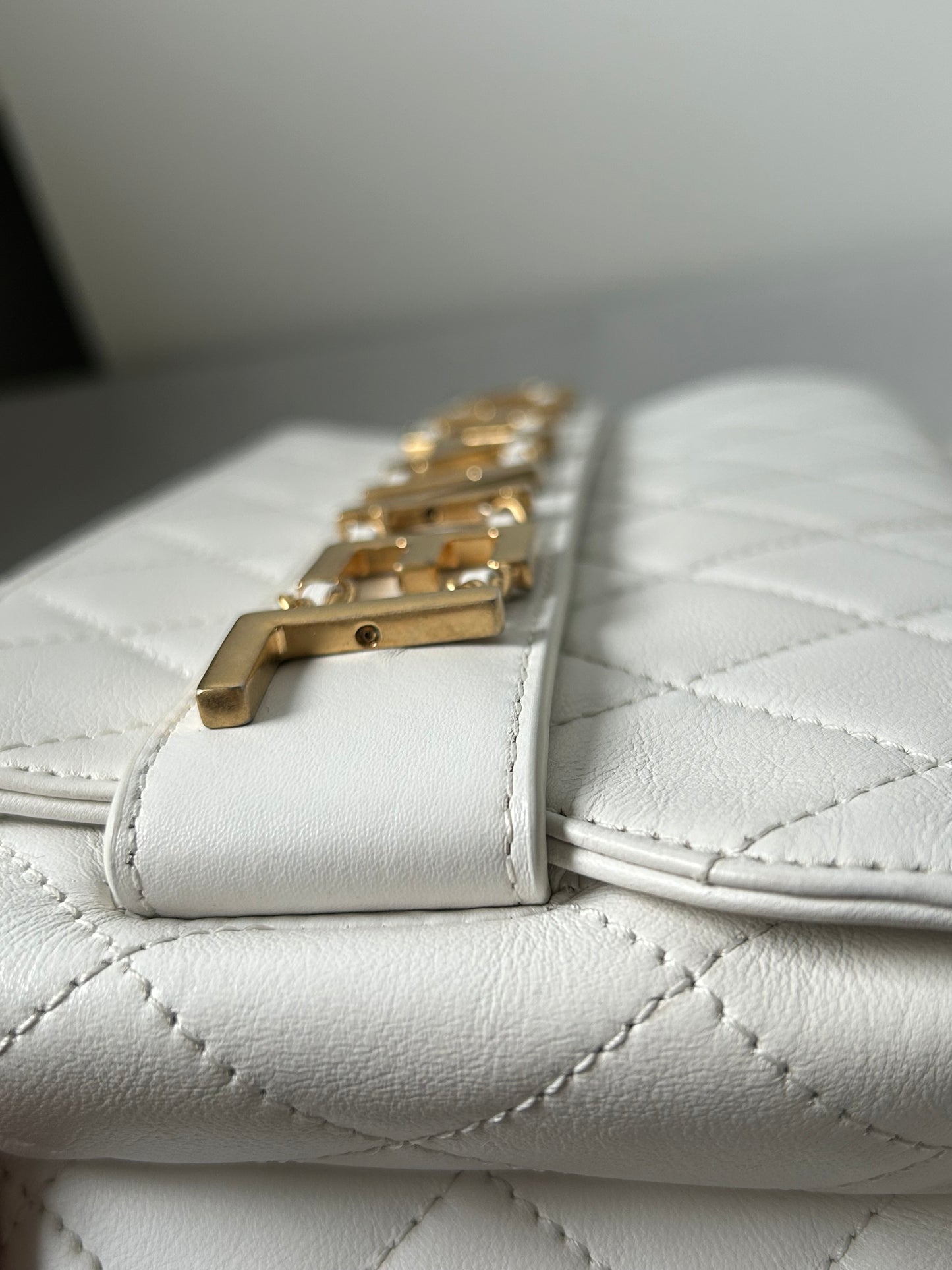 Chanel logo enchained flap bag quilted lambskin