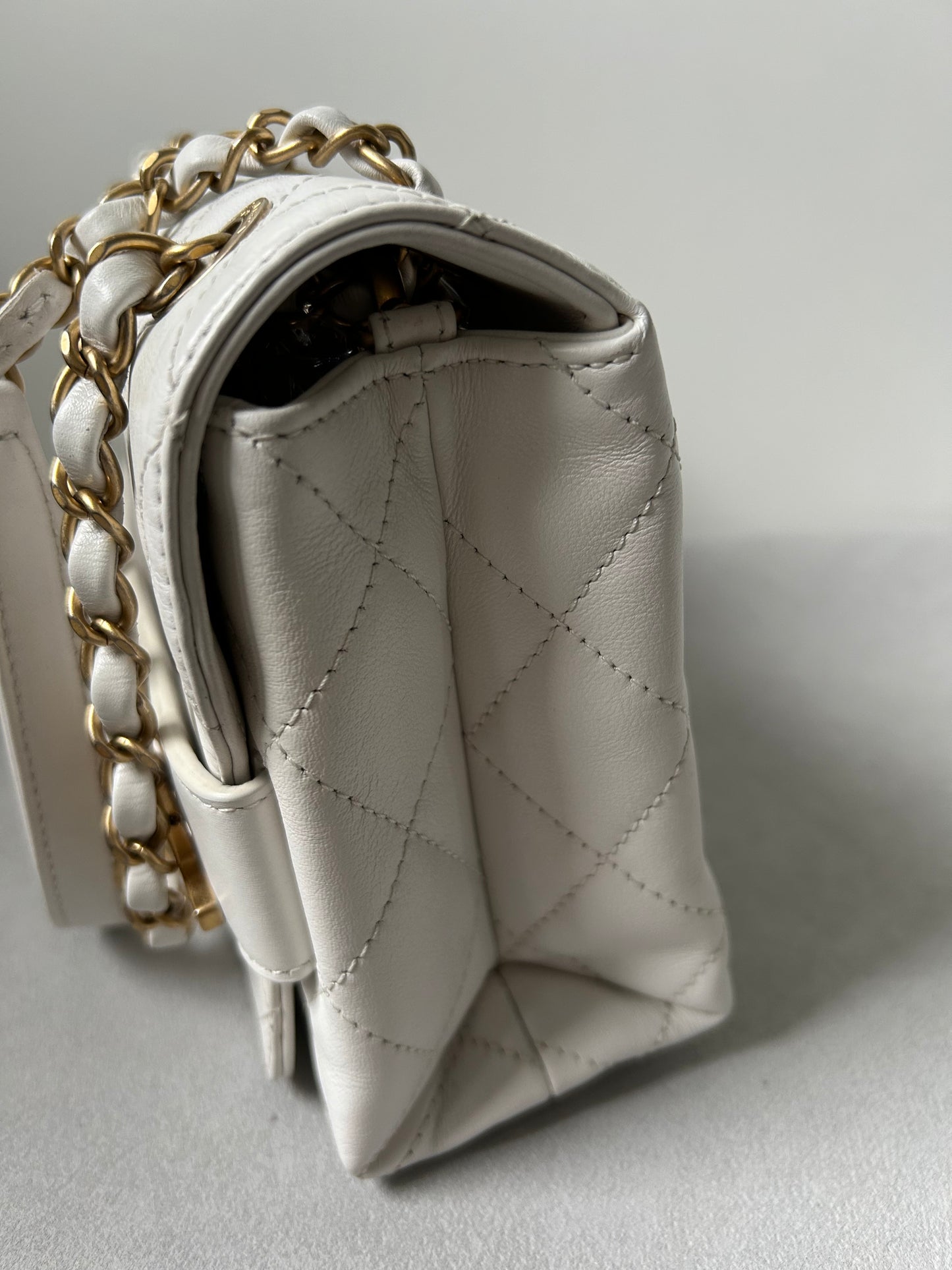 Chanel logo enchained flap bag quilted lambskin
