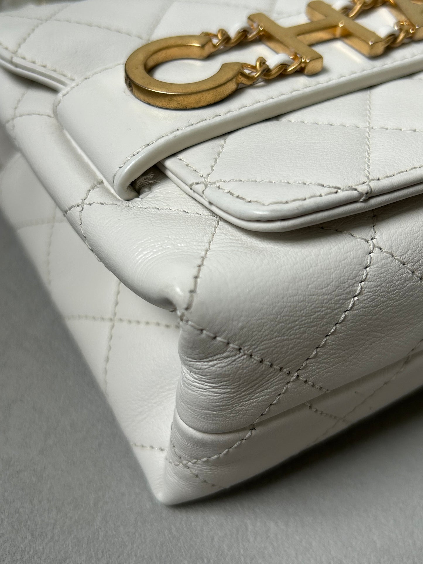 Chanel logo enchained flap bag quilted lambskin