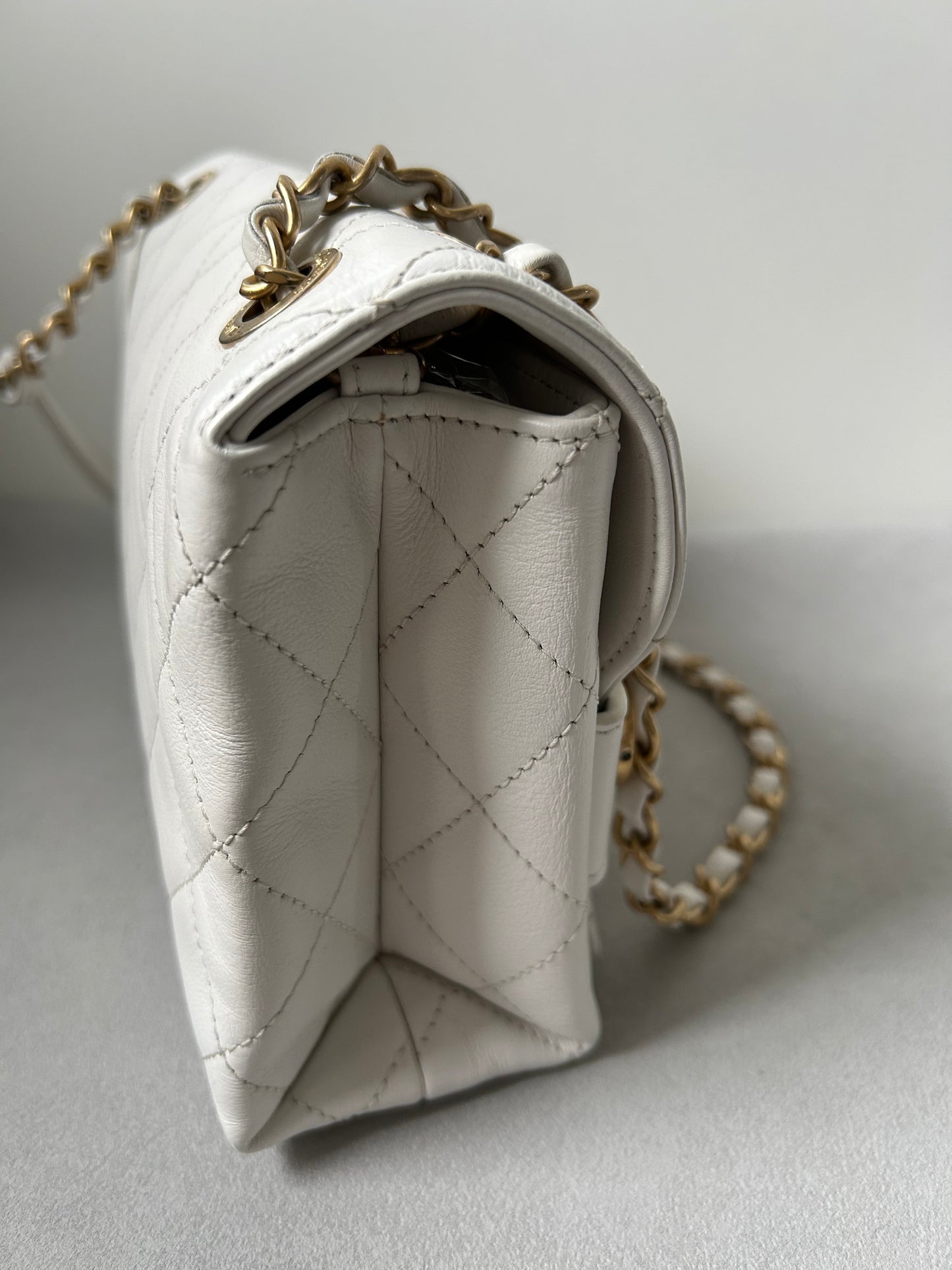 Chanel logo enchained flap bag quilted lambskin