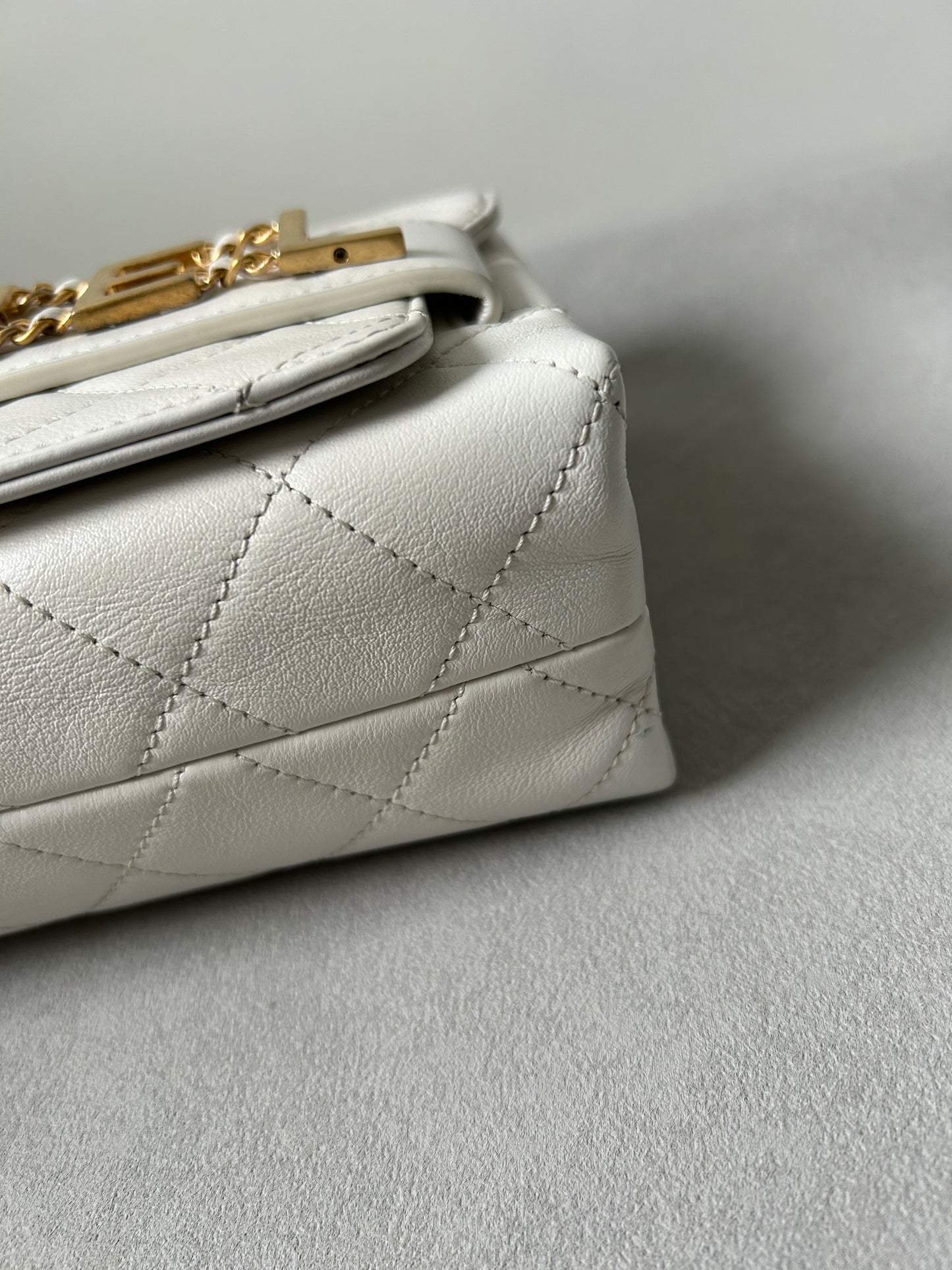 Chanel logo enchained flap bag quilted lambskin