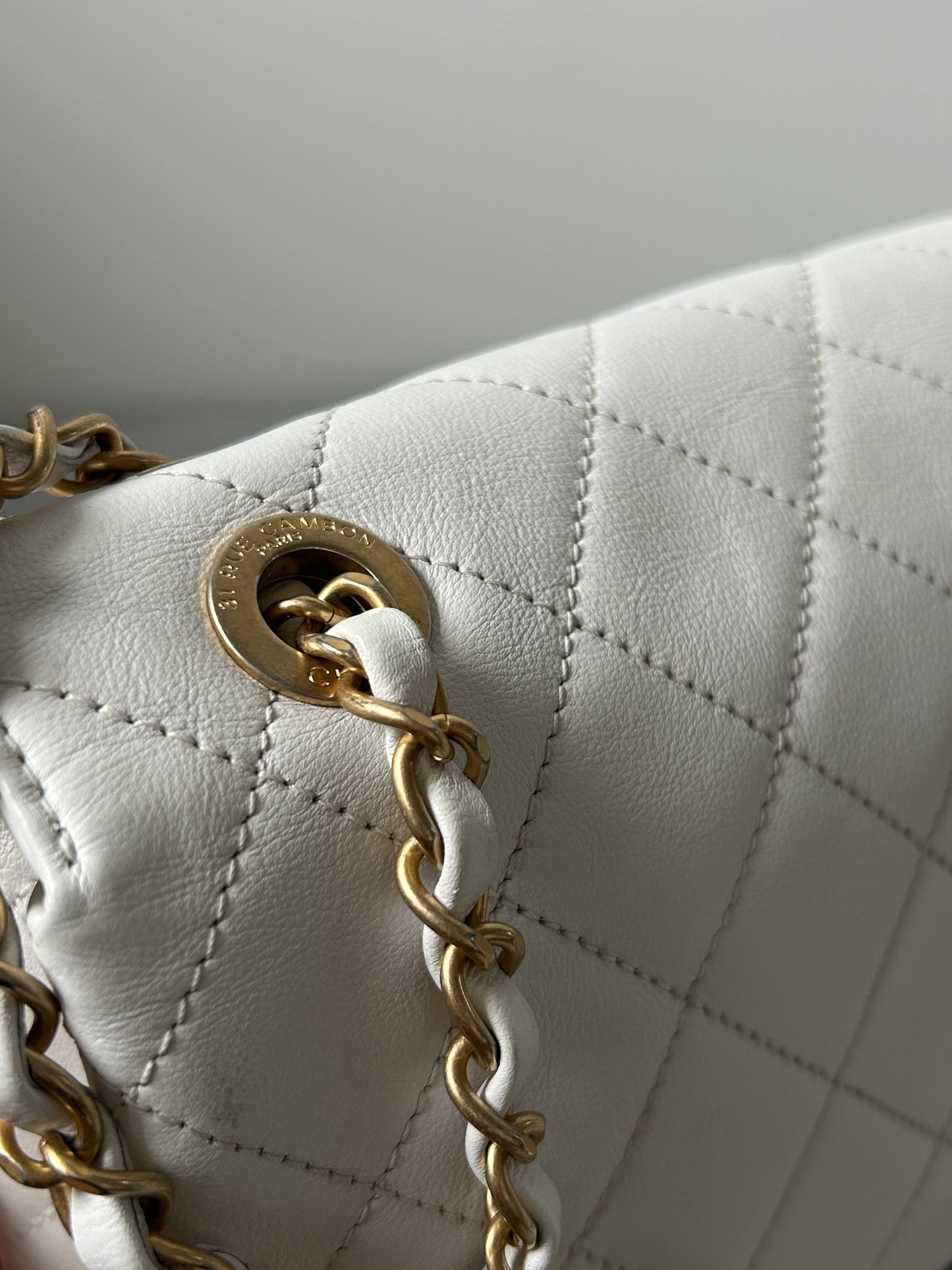 Chanel logo enchained flap bag quilted lambskin