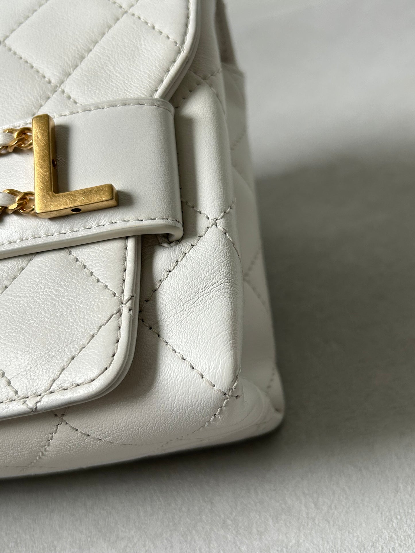 Chanel logo enchained flap bag quilted lambskin