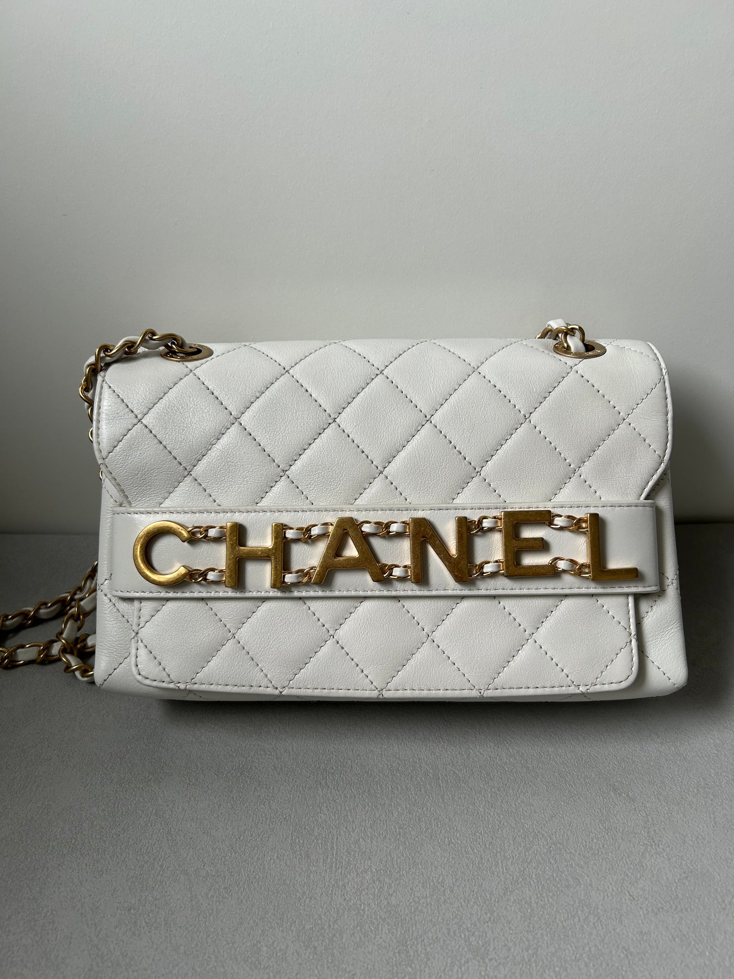 Chanel logo enchained flap bag quilted lambskin