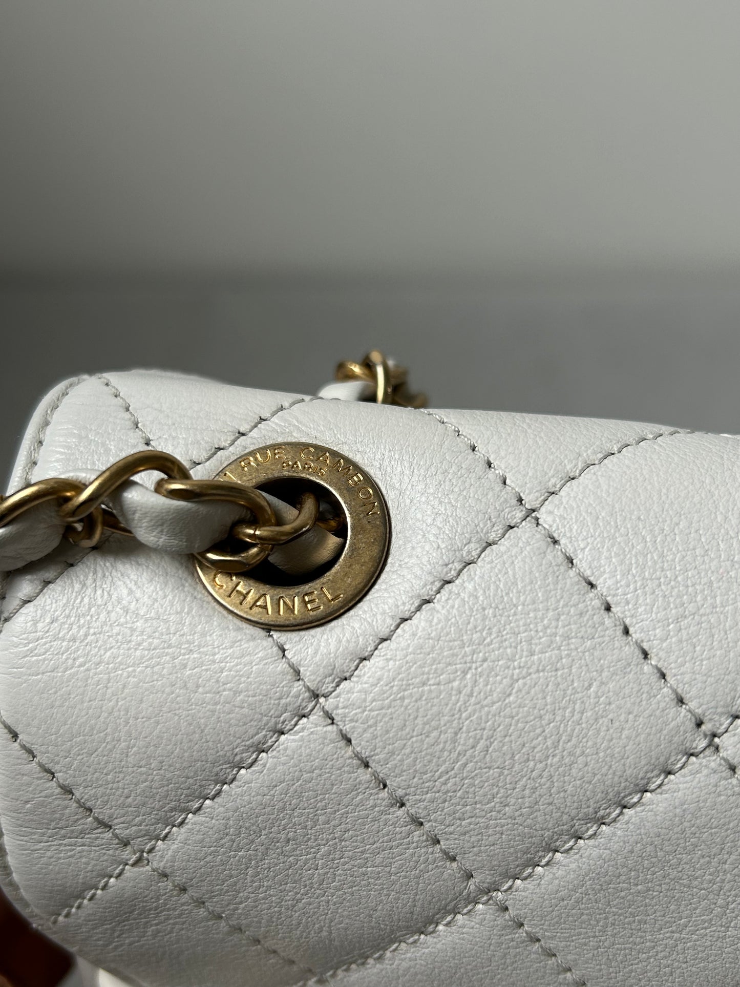 Chanel logo enchained flap bag quilted lambskin