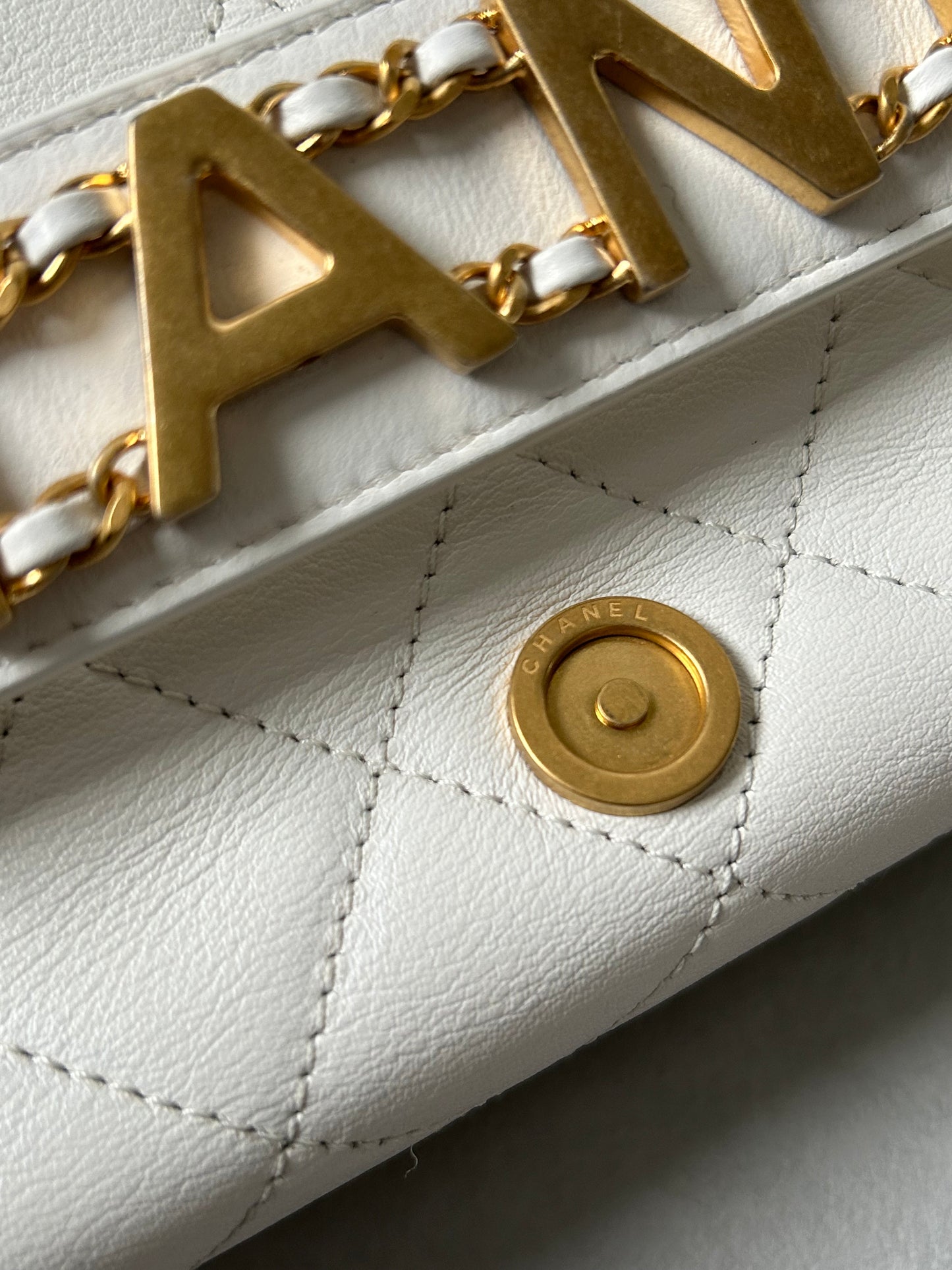 Chanel logo enchained flap bag quilted lambskin