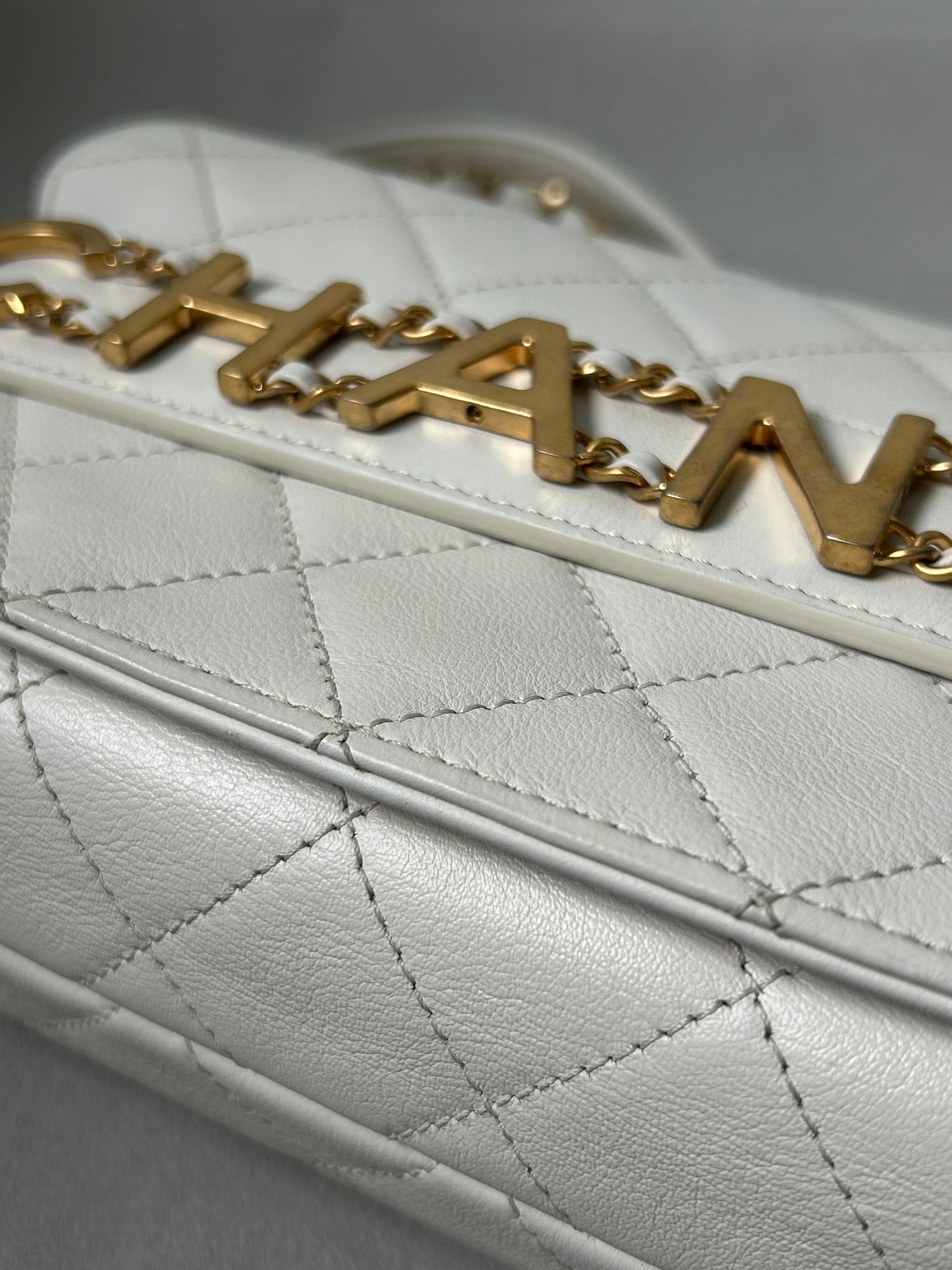Chanel logo enchained flap bag quilted lambskin